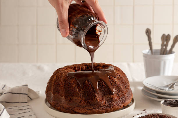 Pouring chocolate in a bundt cake