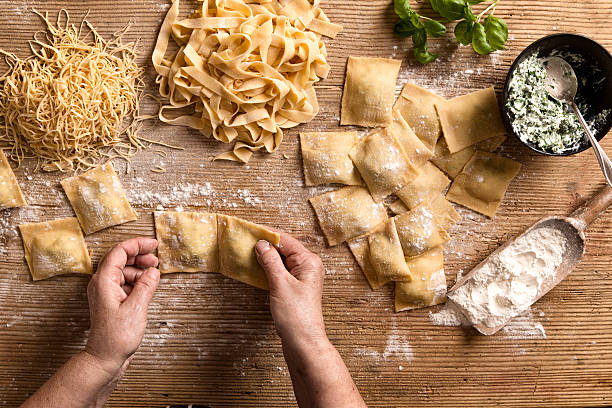 Woman making homemade pasta.